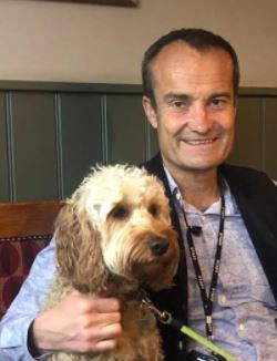 Mr Moore with Tommy, the school dog